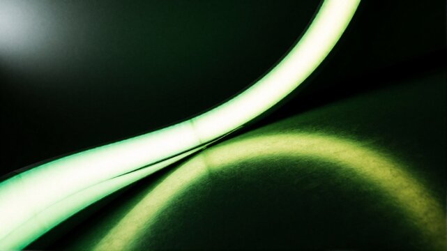Glowing green LED light strip on dark background