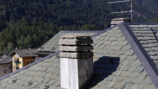 Roofs and chimney of typical mountain construction.
