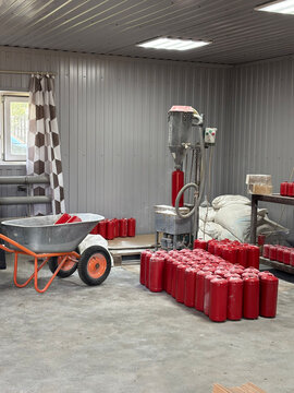 Industrial fire suppression system room with red gas fire-extinguishing cylinders and high-pressure pipes, safety system