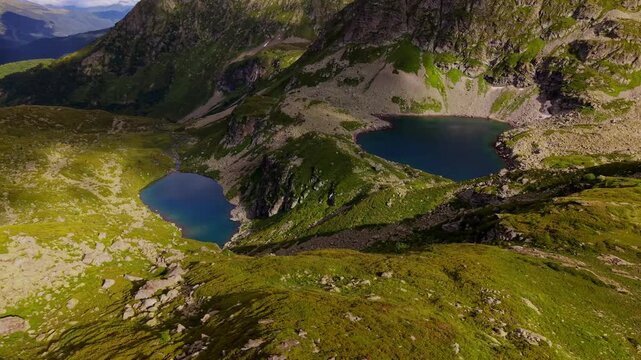 Aerial Forward Movement Over Alpine Lakes and Mountain Valleys