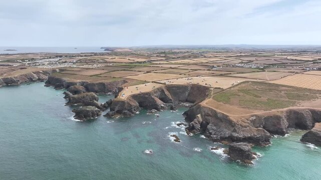 Farms and Fields over Cliffs and Porthcothan Bay from a drone, Porthcothan, Padstow, Cornwall, England, United Kingdom, Summer 2026