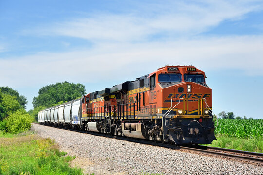 A pair of locomotives are more than enough power for a short Burlington Northern Santa Fe grain train as it moves eastbound through rural north central Illinois.