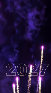 happy new year 2027 greetings, rising pink firework rockets isolated on dark backgound with copy space, new years eve greeting card concept vertical format for social media