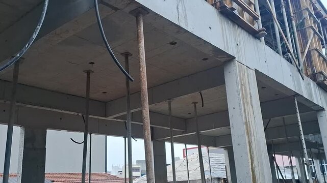 Concrete floor construction site support pillars metal props