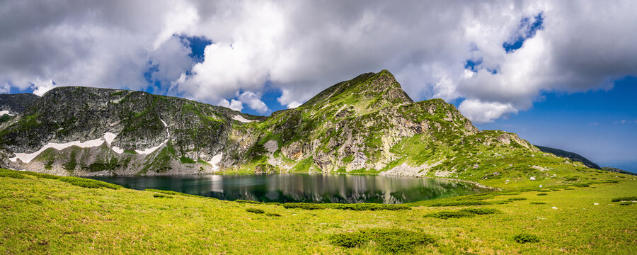 Panoramic view of the Babreka (The Kidney) lake and Malik Kabul peak in summer. One of the Seven Rila Lakes, a famous tourist attraction in Bulgarian mountains.