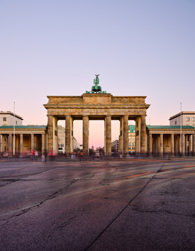 Brandenburg Gate at dusk with blurred crowds in Berlin