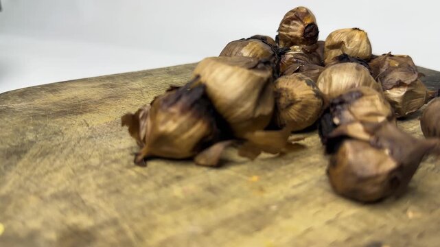 Single clove garlic for herbal medicine on a wooden board