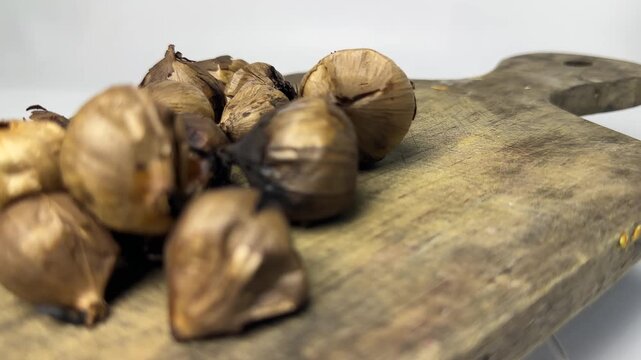 Single clove fermented black garlic for herbal medicine