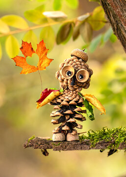 Creative Seasonal Arrangement Made from Acorns, Pinecones and Autumn Leaves