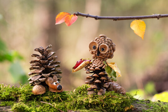 beautiful Handmade animal and figure from pine cone in the Sunlit Forest in fall season