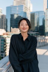 Obraz premium Relaxed woman portrait on rooftop balcony with skyscraper background for lifestyle profile and social media background