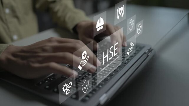 Digital HSE health, safety, and environment platform concept. Person using laptop with hard hat icons, eco leaf and risk audit, corporate sustainability and safety.