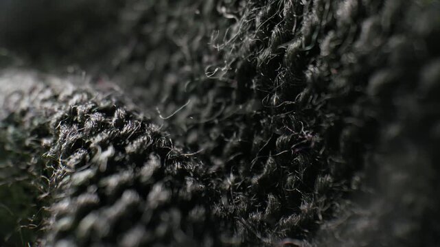 Macro close-up of dark black woven fabric texture