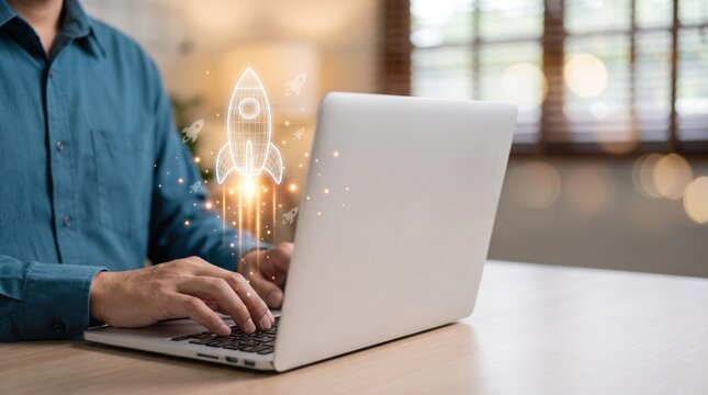 Business professional typing on laptop with glowing rocket startup icon launching upward. Concept of startup business growth, innovation strategy, digital entrepreneurship, technology success and new