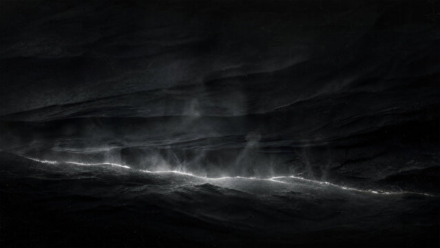 Abstract dark rock surface with glowing light and rising mist