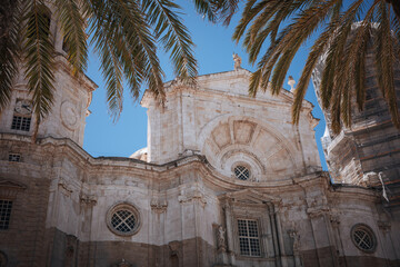Church building in Cadiz with palm trees and clear blue sky in daylight © Bohdan