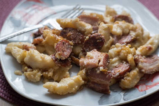 Kopytka &ndash; in Polish cuisine, a type of thick, diamond-shaped dumpling made from boiled potatoes, flour, and eggs.
