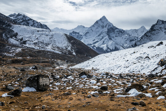 Snow Covered Himalayan Mountain Landscape with Dramatic Peaks and Rocky Alpine Valley