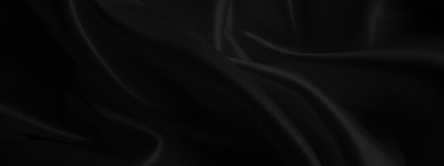 Fototapeta premium Close up of black fabric waves background texture