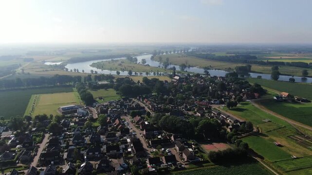 Aerial view of a Dutch village and the Maas river bend with drone shot