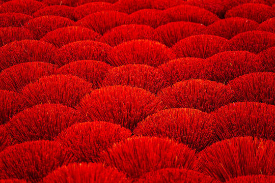 Red incense sticks in the craft village of Quang Phu Cau.  Natural background.
