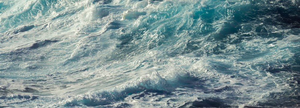 Turbulent Turquoise Ocean Water with Swirling Sea Foam