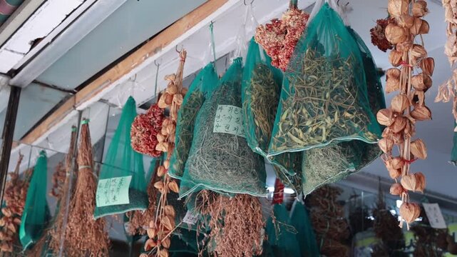 Dried Medicinal Herbs Hanging Outside a Shop at Seoul Yangnyeong Market in South Korea