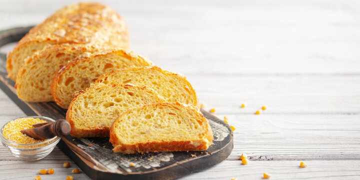 Fresh cornbread and corn grains on the table. Food grain crisis concept