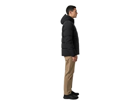 A man wearing a black hooded puffer jacket and khaki trousers in profile view