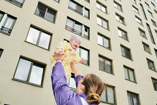 Mother plays with a baby