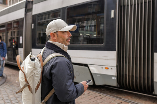 Profile of Man Tourist Waiting for Tram in Ghent Belgium