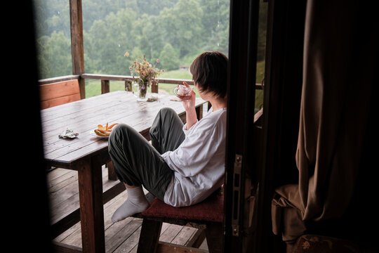 Enjoying a drink and snacks on a porch in the countryside