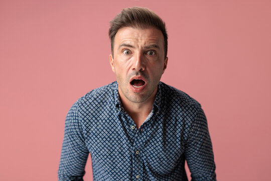 Shocked man with open mouth looking forward
