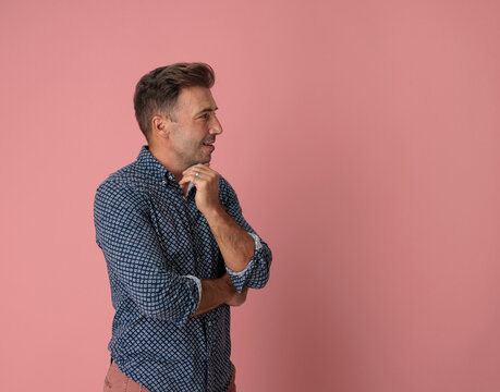 Side view of thoughtful man touching chin