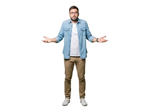 A confused man in a denim shirt shrugging his shoulders with uncertainty