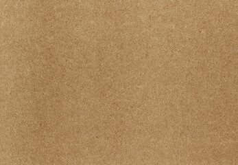 Kraft paper texture with dense brown fibers and scattered dark specks in a blank sheet, a matte packaging background with pressed pulp grain for scrapbook pages and collage © Alexandr Peers