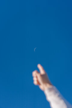 Pointing Toward Crescent Sky