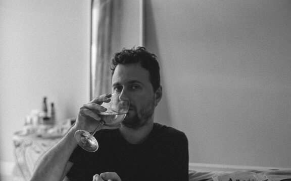 Man Sipping White Wine