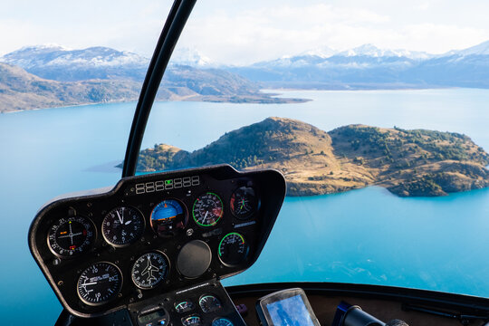 Helicopter Cockpit Over Turquoise Lake