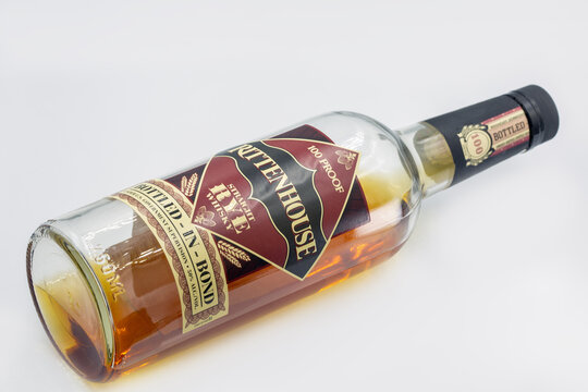 Rittenhouse Rye 100 proof American whiskey bottle closeup on white.