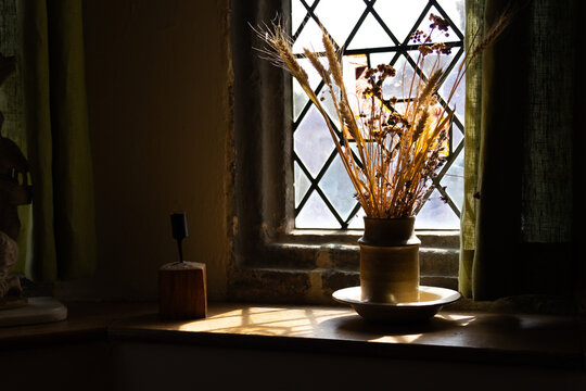 Dried flowers on the windowsill