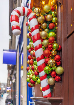 Giant candy cane decorations with colourful Christmas baubles