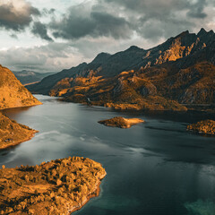 Panoramic aerial view of a scenic fjord surrounded by majestic autumn mountains in northern Norway © Quality by Simon