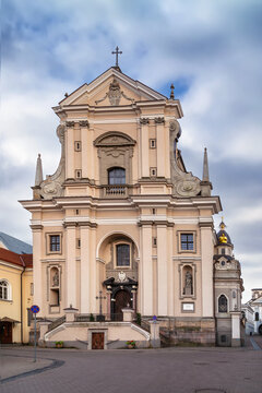 Front view of the facade of Church of St. Teresa in Vilnius, Lithuania. Early Baroque stone architecture and cloudy sky