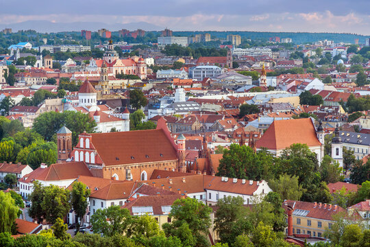 South view of Vilnius old town cityscape from Three Crosses hill in Lithuania. Historic stone architecture with cloudy sky