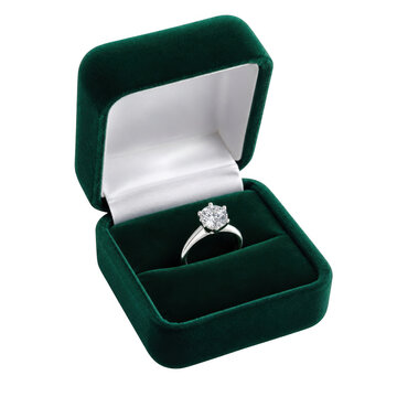Diamond engagement ring in a small green velvet box as isolated on transparent background