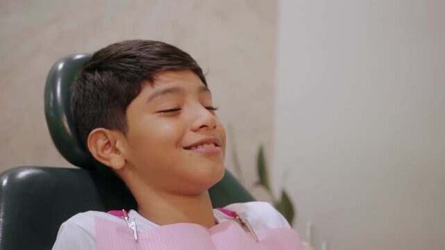 Contented boy waiting in a dentist's chair