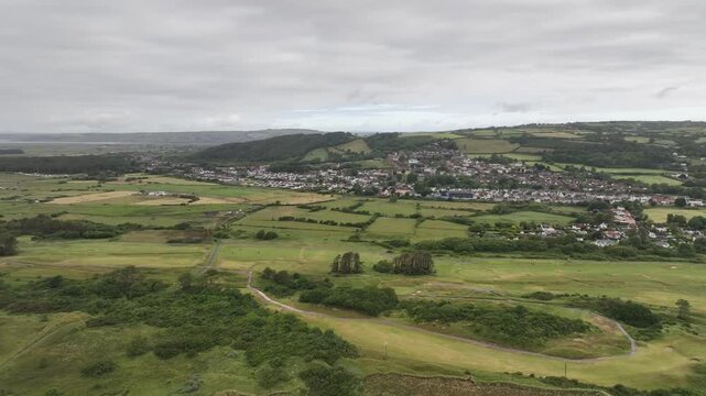 Aerial Drone Panorama of Welsh Countryside Village and Green Fields in Carmarthenshire UK