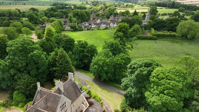 Aerial Drone View of Barnwell Village Stone Cottages and Country Church Northamptonshire
