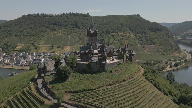 Aerial Reveal of Cochem Castle Above Vineyards in Germany